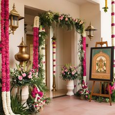 a luxurious and elaborate floral arrangement, possibly part of a wedding or a ceremonial event. The setup includes hanging floral chandeliers, large flower sculptures resembling lotus flowers, and intricately designed floral arches. The backdrop includes lush greenery, and the setting appears to be outdoors or in a large open space with a high ceiling. The overall ambiance is elegant and opulent, with a strong emphasis on floral decor. Lotus Wedding Decor Indian, Indian Home Engagement Decor, Banquet Decorations Elegant, Lotus Decoration Ideas Wedding, Luxury Indian Wedding Decor, Indian Wedding Backdrop Decorations, Lotus Theme Decoration, Indian Wedding Decorations Mandap, Traditional Hindu Wedding Decor