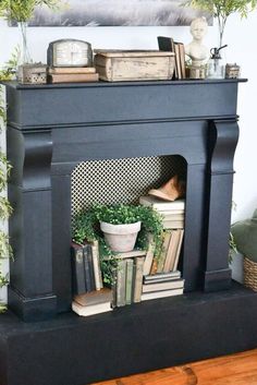 a fireplace with books and plants on top