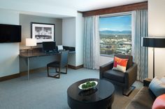 a living room filled with furniture and a flat screen tv