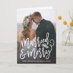 a wedding card with the words married and merry written in cursive font on it