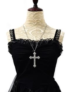 Embrace the cyberpunk, gothic, steampunk, and retro vibes with our unique cross necklace. This single necklace captures the essence of multiple alternative fashion styles, making it a versatile and edgy accessory. Add a touch of mystery and individuality to your look with this statement piece.   Please note that this product includes only the necklace. Edgy Metal Cross Necklace, Gothic Cross Pendant Jewelry For Party, Gothic Metal Cross Necklaces, Punk Cross Jewelry For Halloween, Punk Style Cross Jewelry For Halloween, Gothic Cross Pendant Clavicle Chain Necklace, Punk Style Cross-shaped Halloween Jewelry, Gothic Clavicle Chain Necklace With Cross Pendant, Gothic Metal Cross Necklace