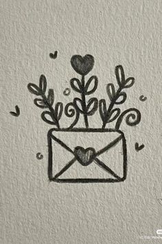 an envelope with flowers and hearts drawn on it