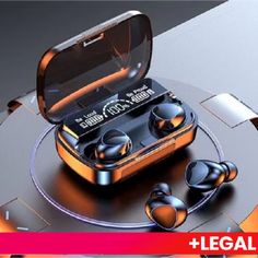 an orange and black electronic device with ear buds in it's case on top of a table