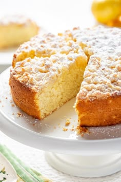 a cake on a plate with one slice cut out and the other half eaten from it