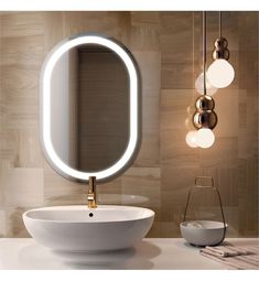 a bathroom with a sink, mirror and lights on the wall next to each other