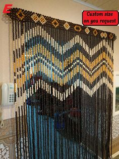 a wall hanging made out of beads with a sign above it that says custom size on you request