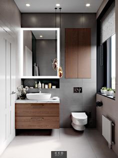 a bathroom with a toilet, sink and mirror