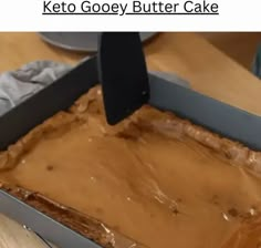 a cake in a pan with peanut butter frosting