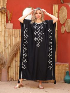 An elegant Moroccan caftan will make you feel like African royalty. It's extremely elegant with a dash of classy cotton embroidery in the front. Ideal for plus size women as well. Made of extremely soft fabric to make you feel free and beautiful at the same time.  This Kaftan is ideal to wear for any casual occasion. Whether taking a trip down the shopping lane, or home-based kitty parties, or about anything else, wearing this dress will make you feel classy and comfortable. Fabric : 70% Egyptia Oversized Cotton Kaftan, Elegant Abaya For Vacation, Black Kaftan For Beach And Eid, Eid Beach Black Kaftan, Elegant Embroidered Kaftan For Vacation, Elegant Cotton Beach Kaftan, Elegant Cotton Kaftan For The Beach, Oversized Tunic Abaya, Floral Embroidered Maxi Dress For Beach Cover-up