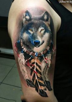 a wolf with feathers on his arm