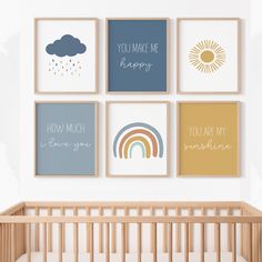 a baby's room with four framed pictures on the wall and a crib