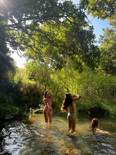 two girls in the water playing with each other