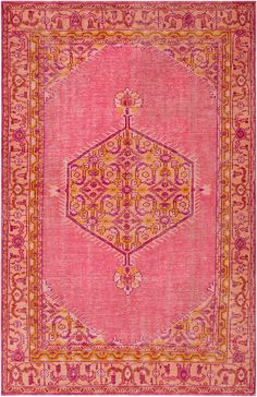 a pink and yellow rug with an ornate design