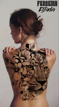 the back of a woman's body with flowers and a cheetah on it