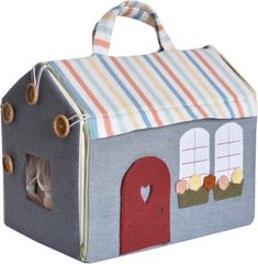 a small toy house with a door and windows