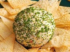 a green and white cheese ball surrounded by tortilla chips