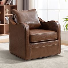 a brown leather chair sitting on top of a rug in front of a book shelf