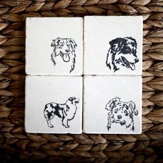 four coasters with dogs on them in black and white, sitting on a wicker basket