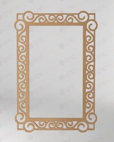 a paper cutout of a square frame with swirly scrolls on the edges and sides