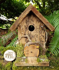 a bird house with moss growing on it