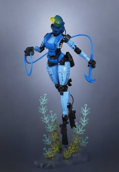 a robot that is standing in the air with a hose on its back and arms