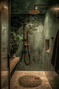 a bathroom with green walls and a shower head in the corner, along with a rug on the floor