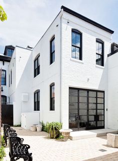 a white house with black doors and windows