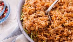 a bowl filled with rice and beans next to another bowl