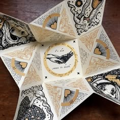 an origami star with some designs on it