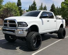 a large white truck parked in a parking lot