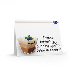 a greeting card with an image of a pudding topped with blueberries and green leaves