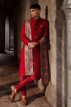 Red full sleeve sherwani with floral quilted pattern and mandarin collared neckline. Paired with kurta, churidar and black paisley print shawl.
Components: 4
Type Of Work: Floral
Neckline: Mandarin collar
Sleeve Type: Full sleeves
Fabric: Silk, Chanderi, Lining: Shantoon
Color: Red
Other Details: 
Front button detailing
Note: Pocket square worn by the model is not for sale
Occasion: Destination Wedding - Aza Fashions Red Kurta, Mens Sherwani, Formal Mens Fashion, Groom Looks, Indian Wedding Wear, Luxury Wear, Quilted Pattern, Western Theme, Pernia Pop Up Shop