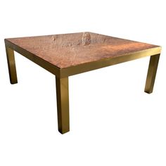 a table that has some kind of metal structure on it's top and legs