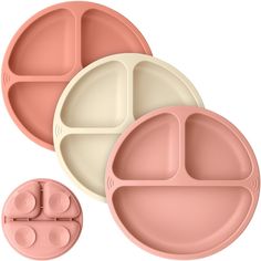 three pink and white plates sitting next to each other