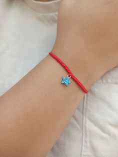 925 k high quality 18k Rose Gold plated star charm with turquoise cz diamonds.  Red string of fate, hand made snake knot woven bracelet.  Minimalist red string bracelet.  All our products are handmade in our workshop with high quality materials. We deliver with branded gift boxes.  Fast delivery.  Great gift for her, gift for mom, gift for mother, gift for girlfriend, friendship bracelets, knotted thread bracelet. Trendy Silver Jewelry With Sliding Knot, Trendy Adjustable Jewelry With Star Charm, Adjustable Dainty Star Jewelry, Minimalist Resizable Jewelry As Gift, Adjustable Dangle Jewelry With Star Charm, Adjustable Turquoise Jewelry With Star Charm, Star Charm Jewelry Gift, Adjustable Dangle Star Charm Jewelry, Resizable Sterling Silver Jewelry For Gifts