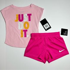 Nike Little Kids Just Do It 2 Piece Tee And Shorts Set!!! **Price Is Firm** No Offers, Ty! Only Discount Is The 5% Bundle Discount Brand New With Tags! A Cool Graphic Nike Tee And Stylish Nike Shorts Make This Nike Set An Easy Choice To Pull Together For Her Active Days. You Choose Size! Available In Toddlers Size 3t Or 4t Tee: Nike Tee, Barely There Sleeves, Just Do It Graphic On Front And 60% Cotton 40% Polyester. Shorts: Nike Mesh Shorts, Elastic Waist, Nike Swoosh Logo On Left Leg, And 100% Playful Pink Short Set With Short Sleeves, Playful Pink Short Sleeve Short Set, Playful Sports Cotton Sets, Pink Short Set For Playwear, Pink Short Top For Playwear, Short Pink Tops For Playwear, Nike Cotton Playtime Sets, Nike Sets With Letter Print And Short Sleeve, Cute Pink Short Set For Playwear