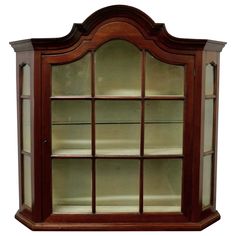 a wooden display case with glass doors on the top and bottom shelves in different sizes