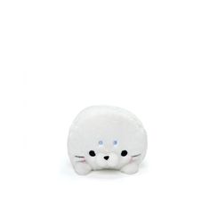 a small white stuffed animal with blue eyes on it's face, sitting in front of a white background