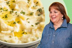 a woman standing next to a bowl of mashed potatoes