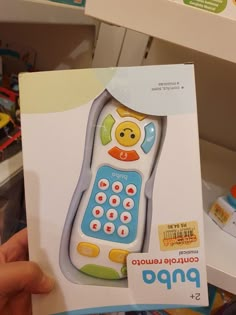 a child's toy cell phone is in the box for sale at a store