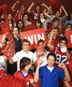 a group of young people holding up signs