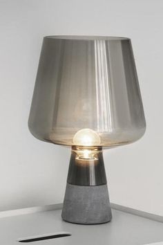 a lamp sitting on top of a white table