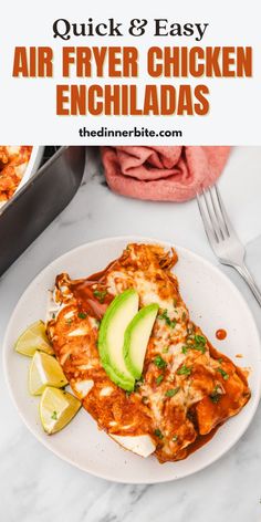 a plate with chicken enchiladas and avocado on it