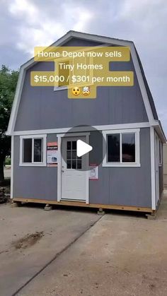 the tiny house is for sale and it's on display in front of an empty lot