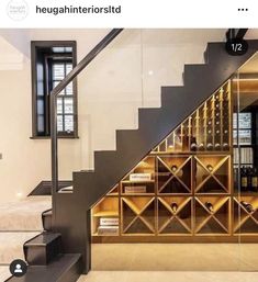 there is a wine rack under the stairs