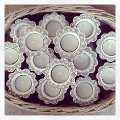 a basket filled with lots of white dishes