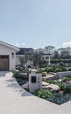 an artist's rendering of a house with landscaping around the front door and driveway