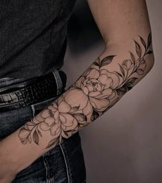 a person with a flower tattoo on their arm