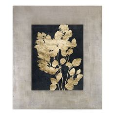 a painting with gold leaves on a black and gray background, framed in a silver frame