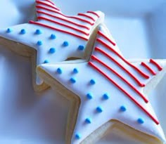 two decorated cookies in the shape of stars